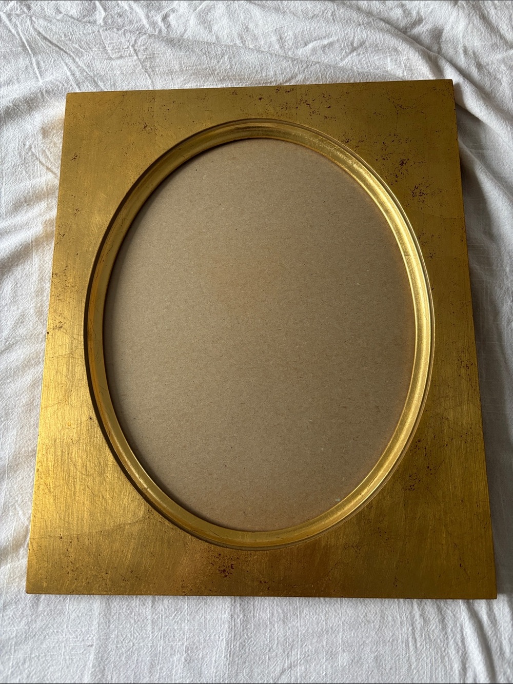 Large wood frame w/oval opening, gold w/red flecks, frame 16.5x13,5”